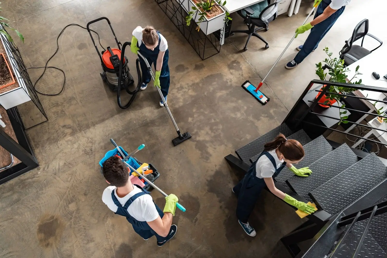 Top view of cleaning company team working together in a modern home