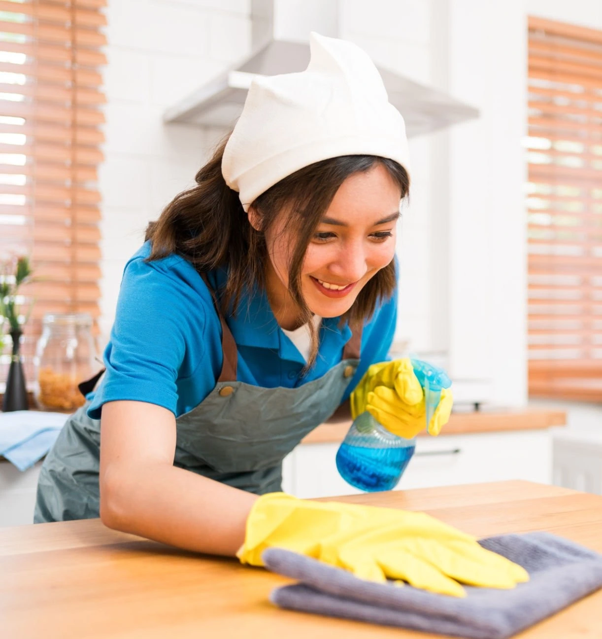 The photo shows a person cleaning with cleaning materials.