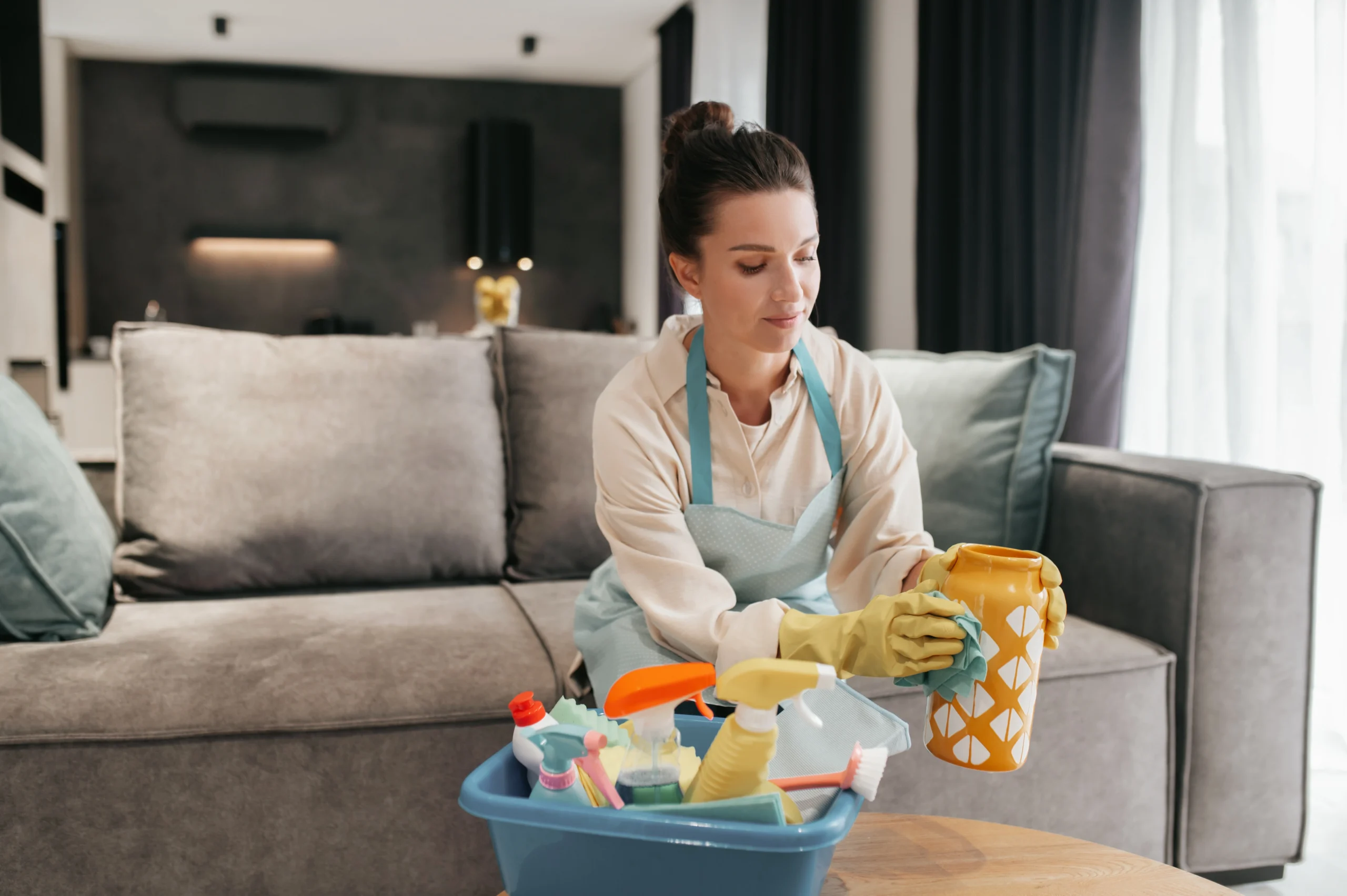 Professional cleaner providing affordable house cleaning services in a modern home
