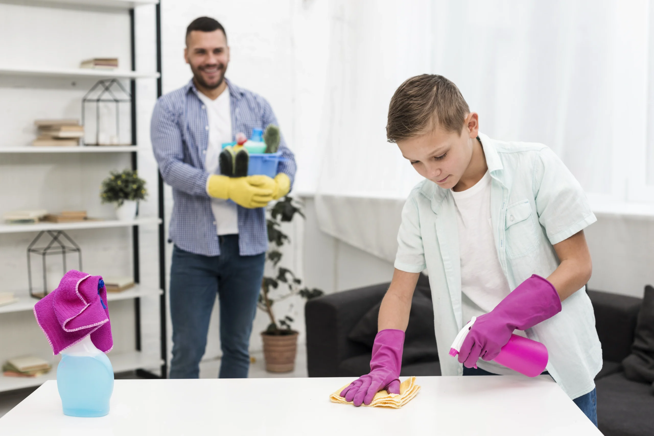 Professional cleaner assisting a senior while another tidies up a family home, showing affordable house cleaning options.