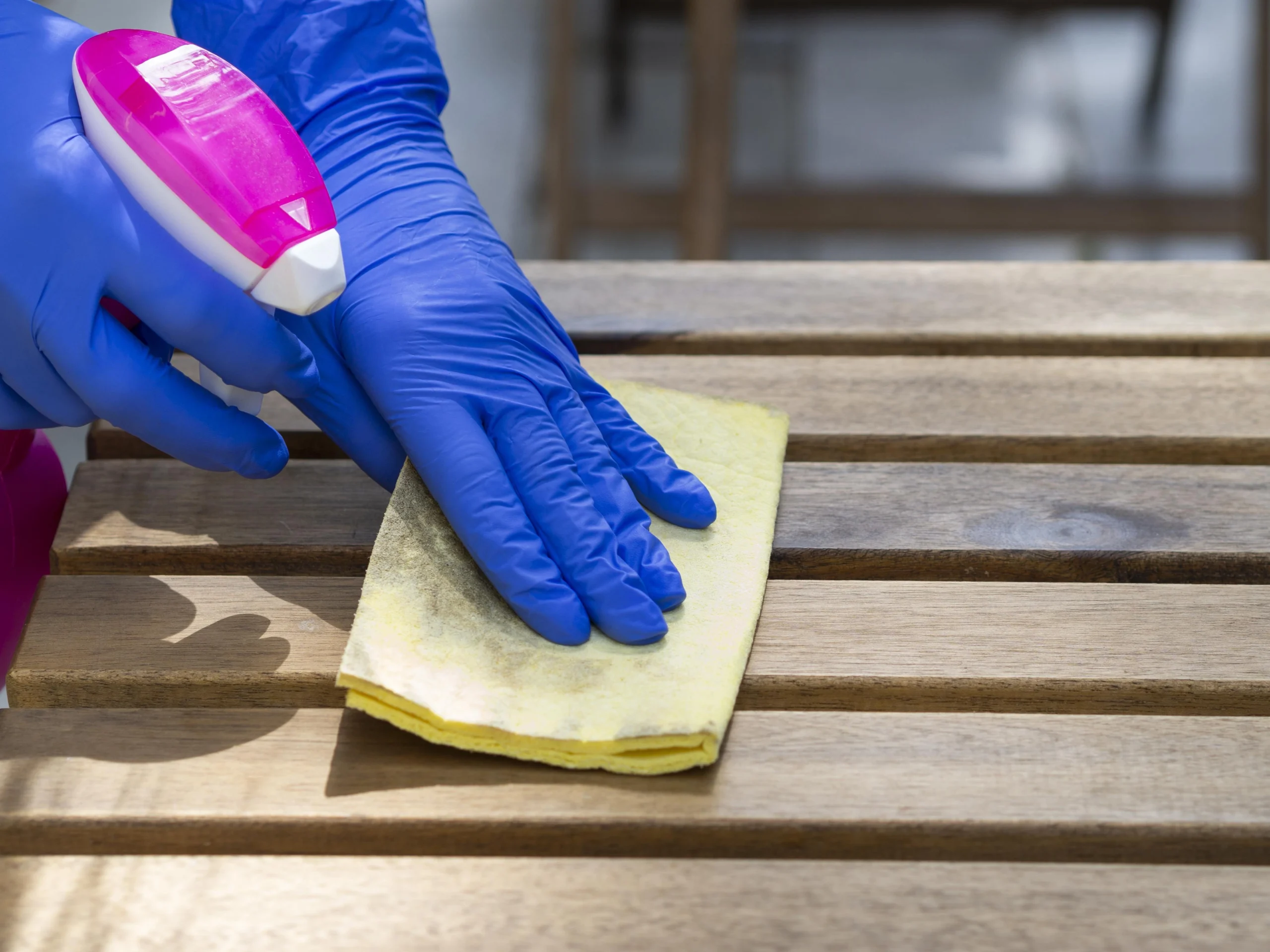Person, learning how to pressure wash a deck.